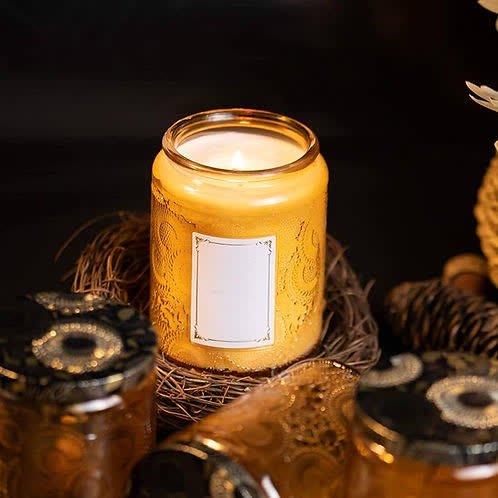 Hand-poured luxury candle glowing